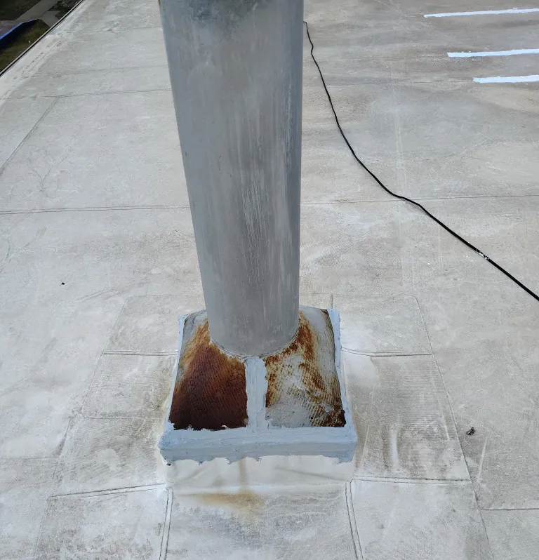 Sealed curb, base flashing and pipe on a single-ply roof