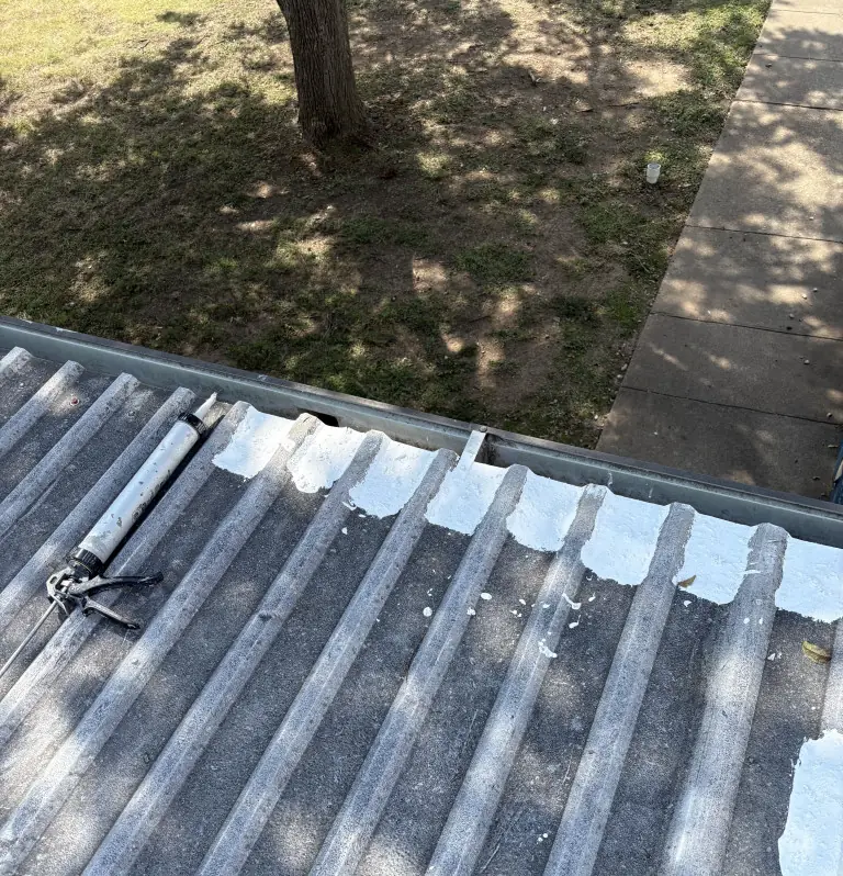 Perimeter edge sealed at the gutter of a U-panel metal roof