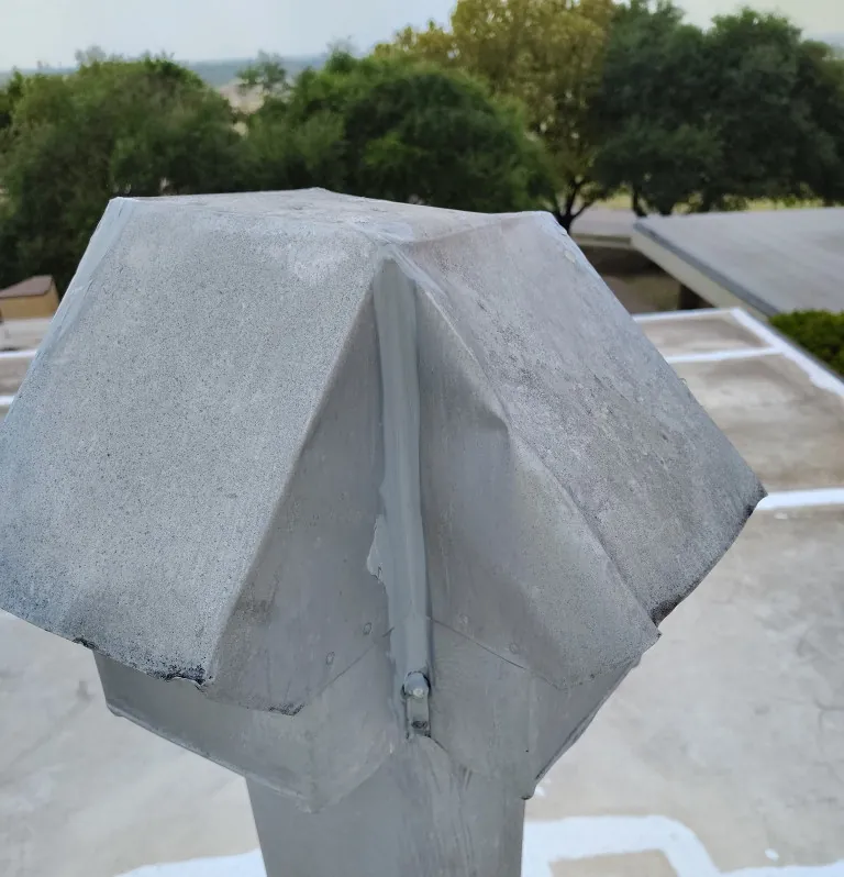 Sealed flashing around a rooftop vent