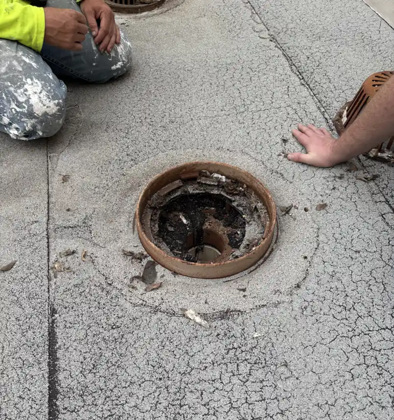 Cracked roof surface around a roof drain