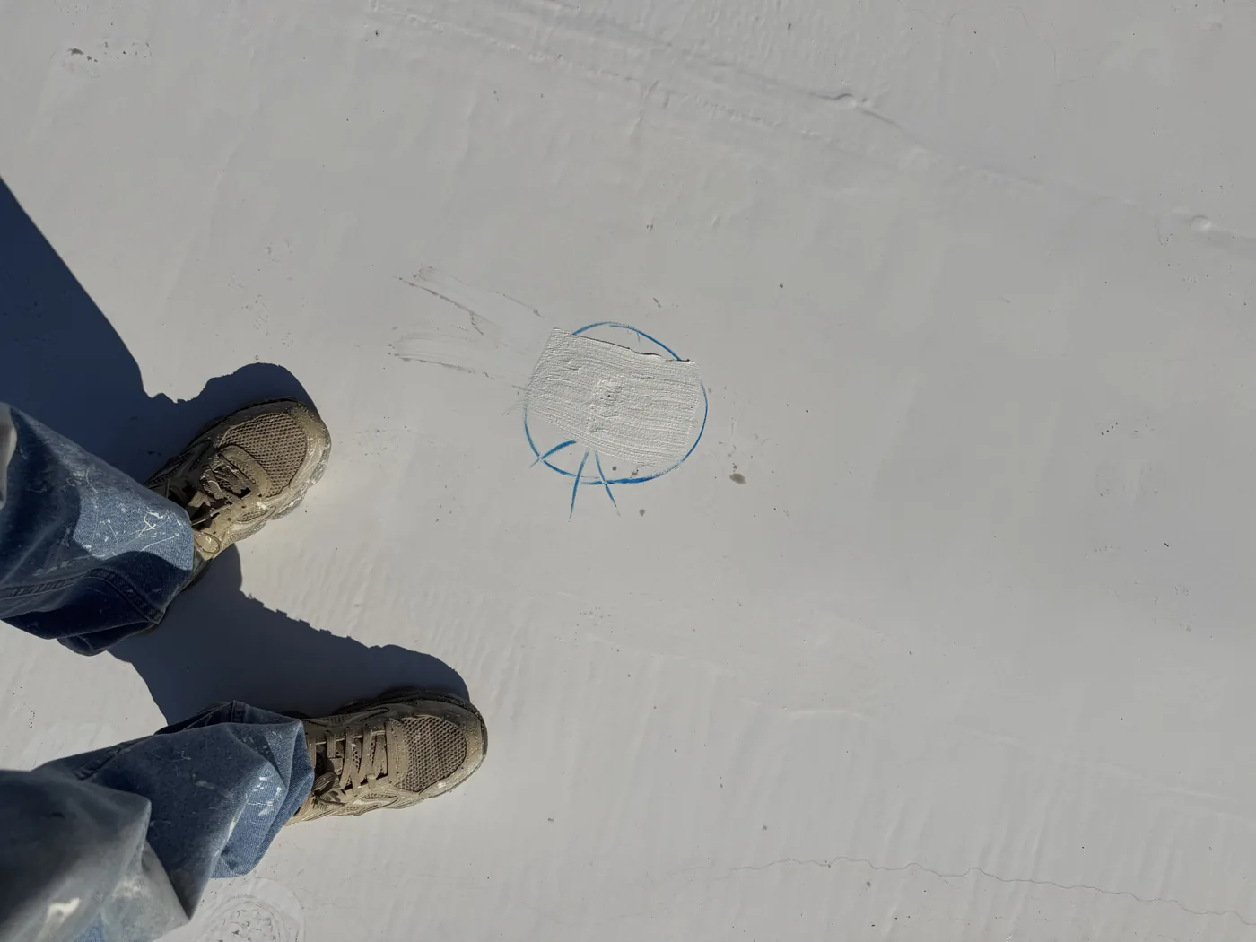 Final inspection mark on the finished white restored roof