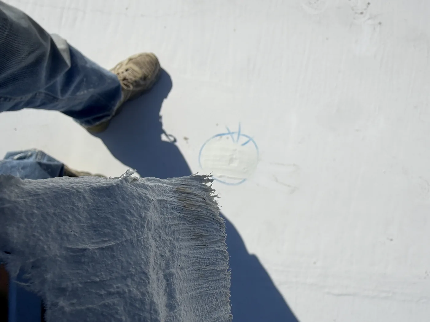 Close-up of the finished white roof surface on a school band hall