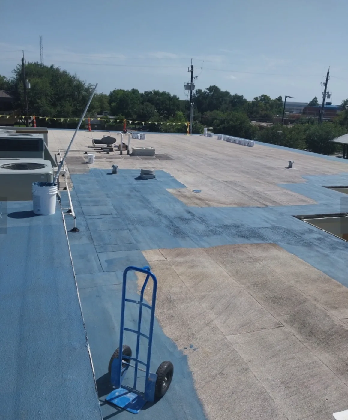 Blue base layer spreading across the roof during restoration