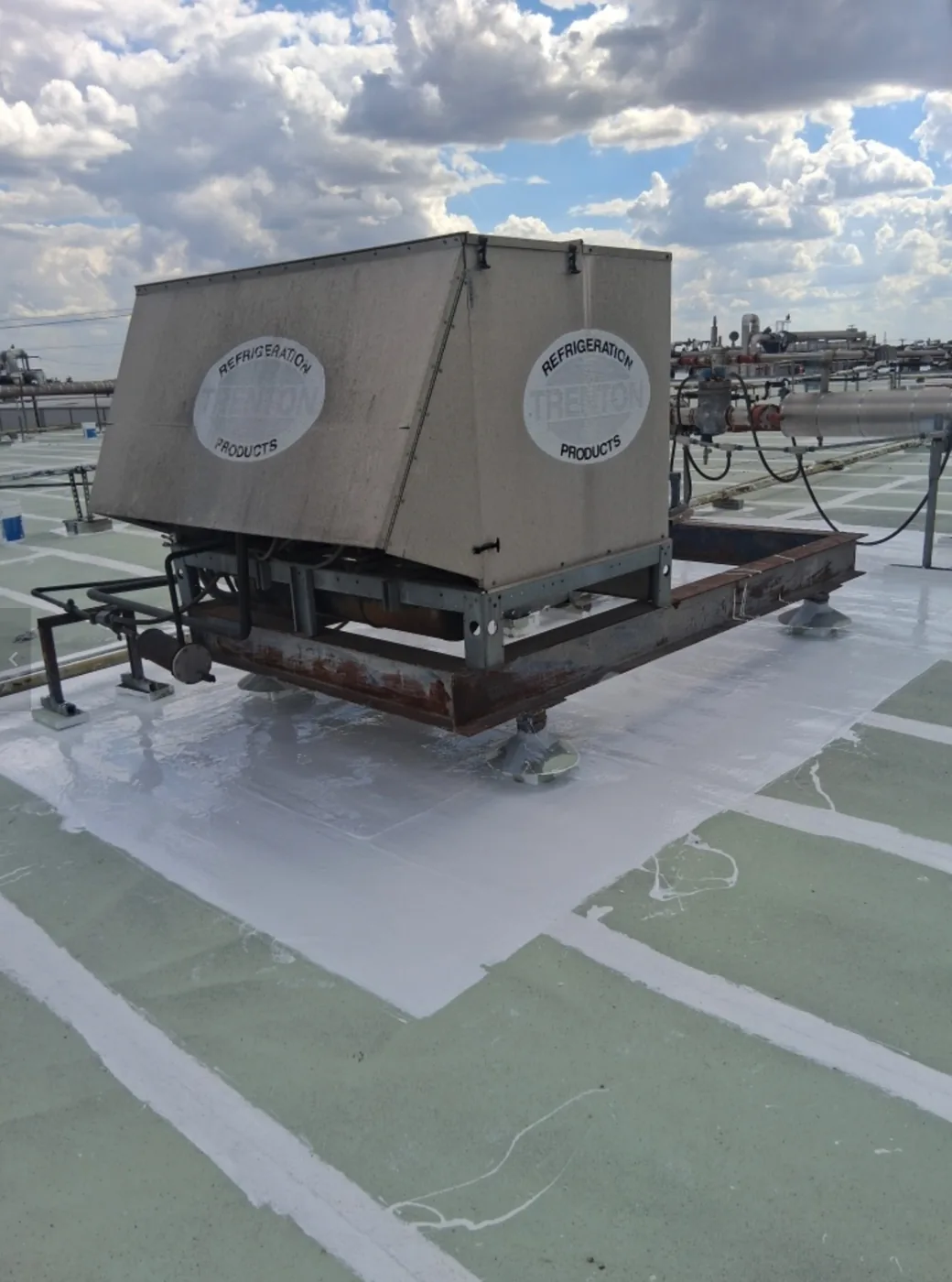 Restored roof around a rooftop unit curb