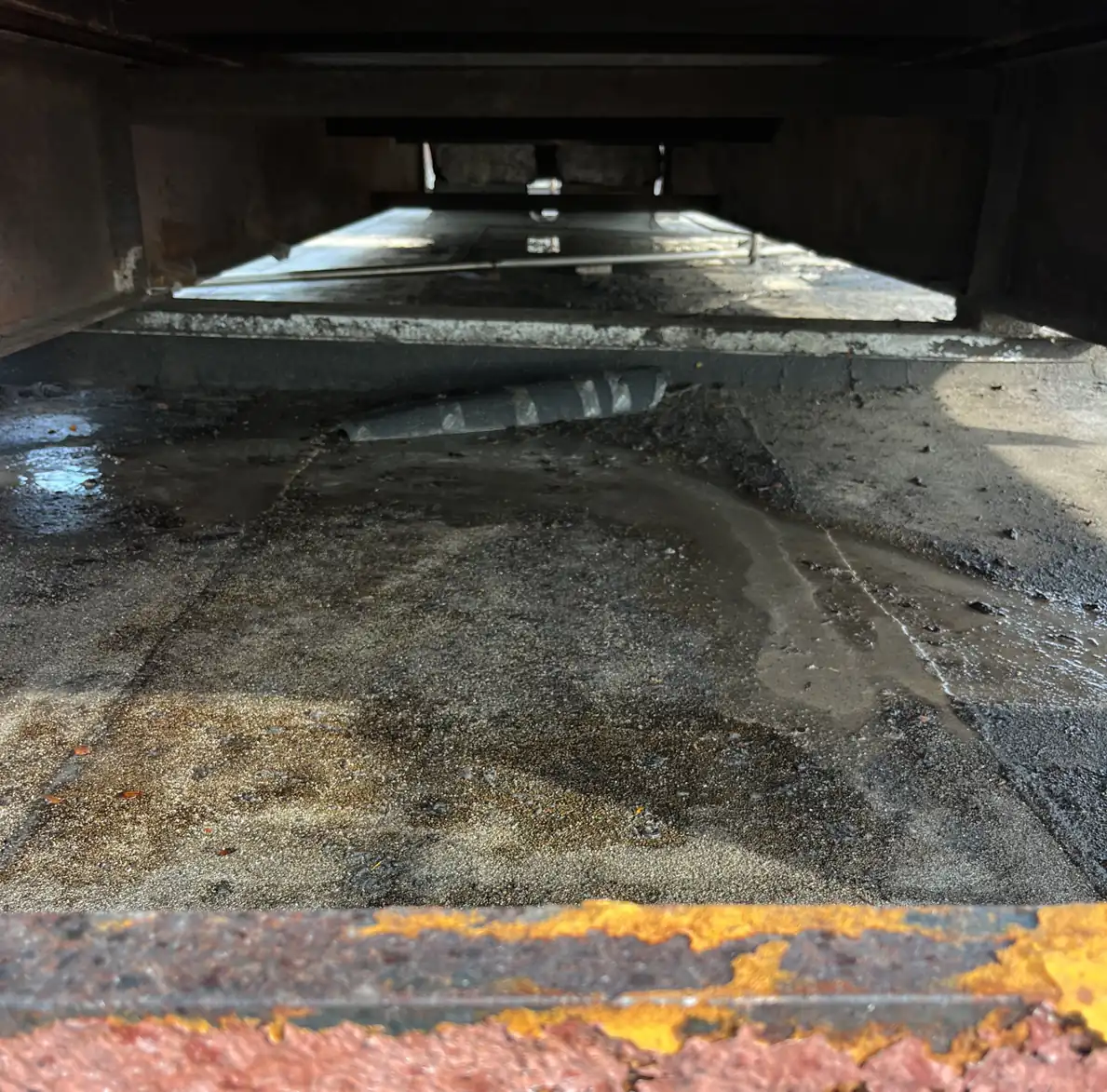 Close-up of corroded, deteriorated roof substrate found during preparation
