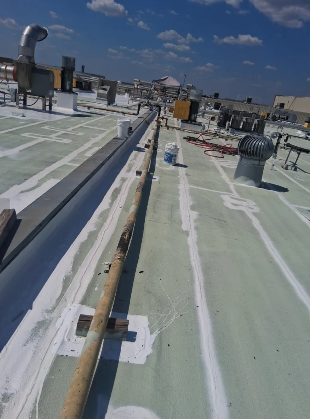 Seams, curbs and walk lanes detailed during a large roof restoration