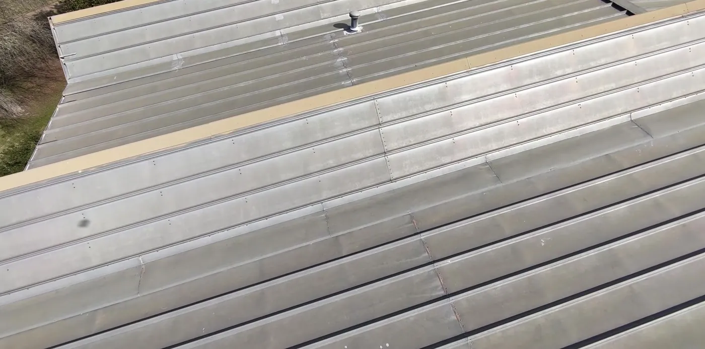 Aerial view of the metal roof and skylight clerestory under repair