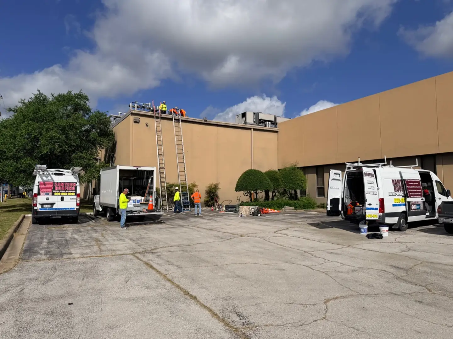 Ramtech crews, service vans, and equipment at a commercial jobsite
