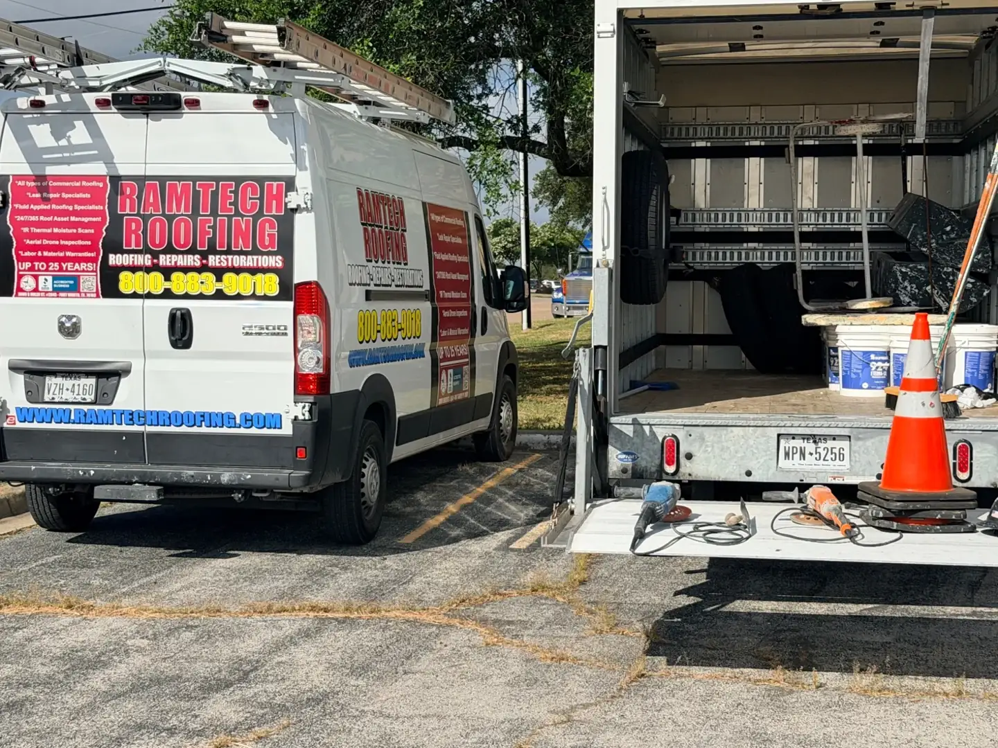 Ramtech service van beside an open work truck with ladders, materials, and tools on site