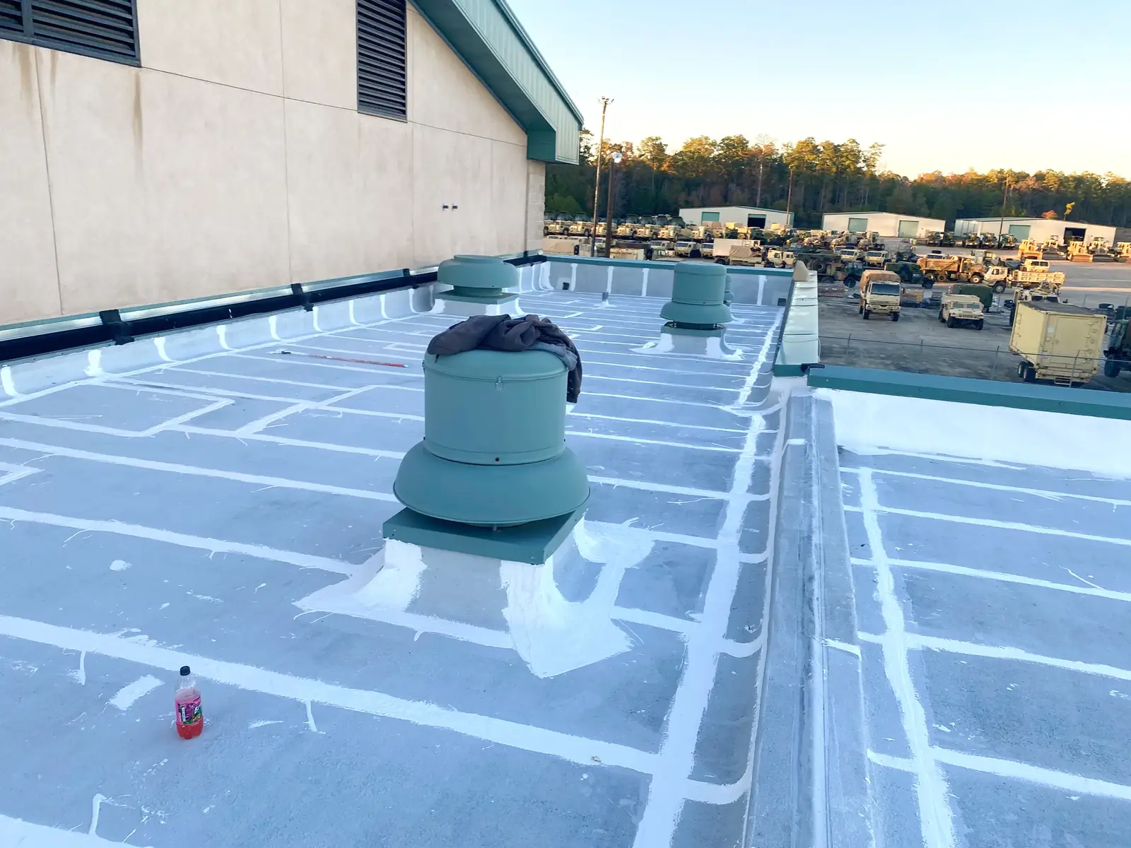 Waterproofing repairs around commercial roof seams and penetrations